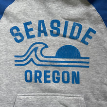 Load image into Gallery viewer, Gray hoodie with 'Seaside Oregon' text and logo on a plain background
